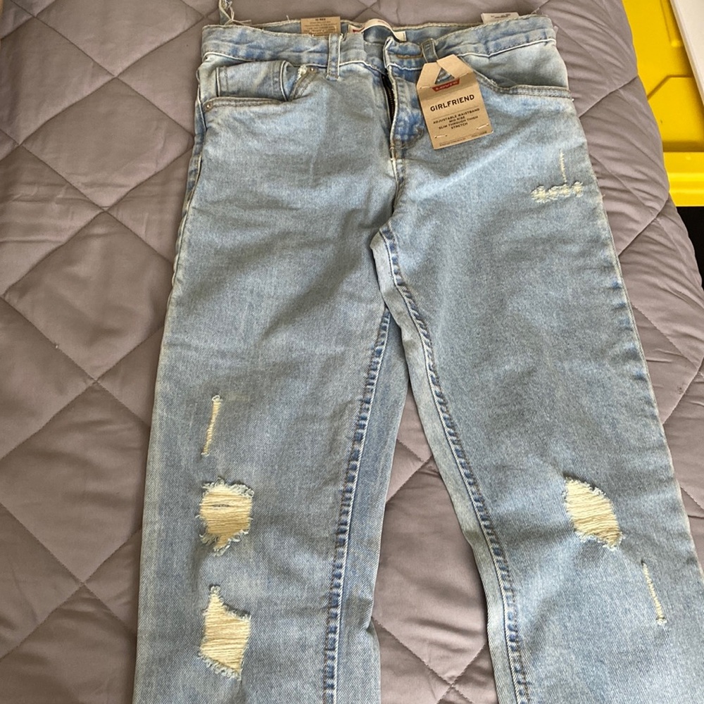 Levis/Girlfriend jeans . It is torn belt loop.